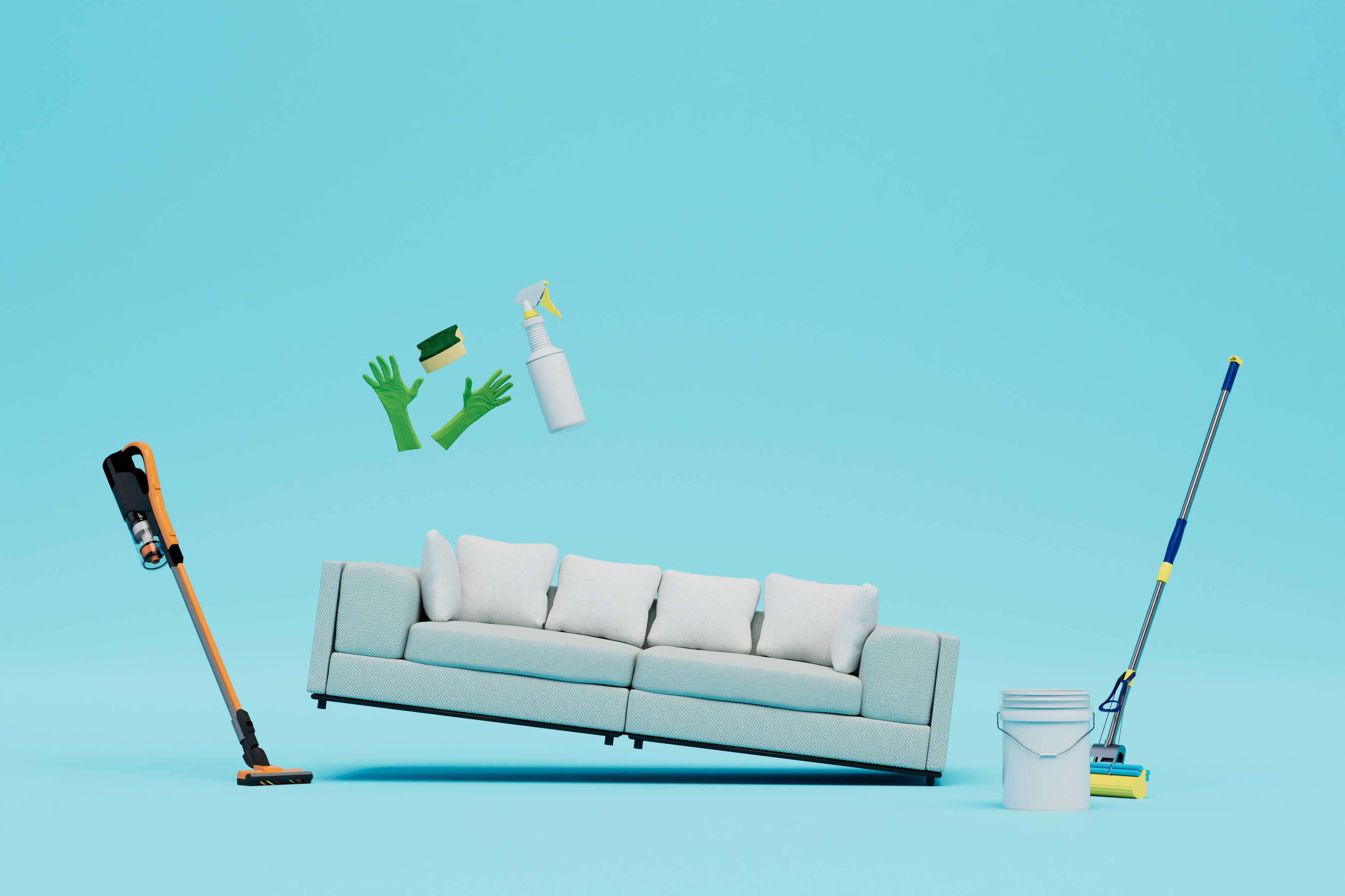 Cleaning tools arranged around a living room sofa